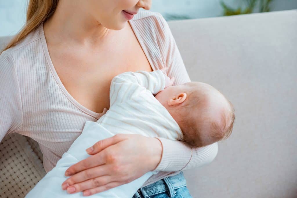 young mother breastfeeding her baby