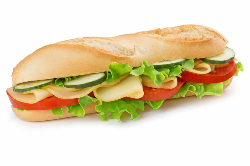 vegetable sandwich which made up of cucumber, tomato, lettuce and cheese