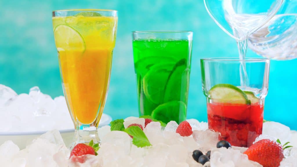 spritzer drinks with fresh fruits and sparkling mineral water