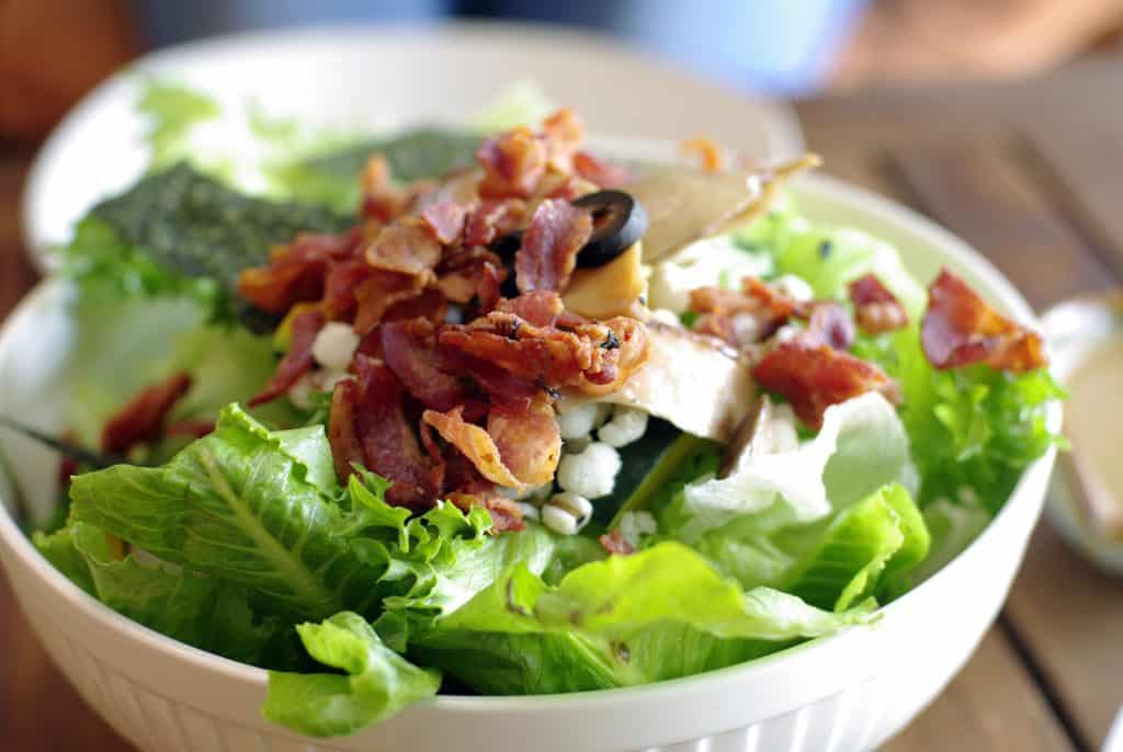 caesar salad with bacon in a bowl