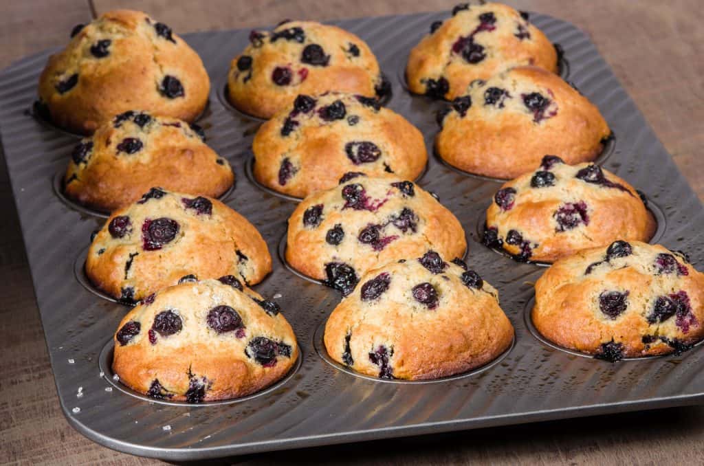 baked blueberry muffins in muffin molder