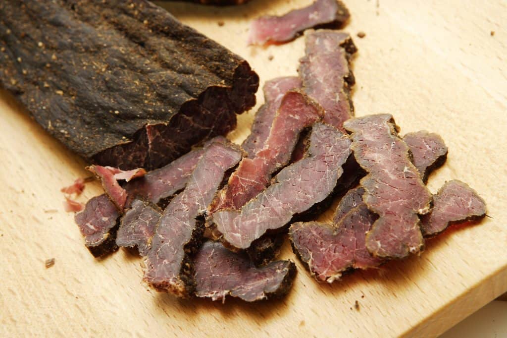 sliced biltong on a chopping board